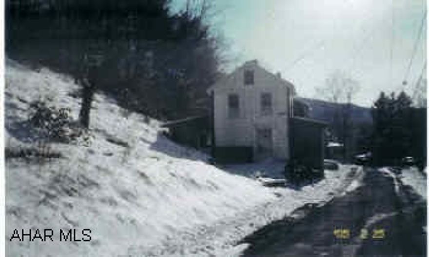 2-Story fixer-upper with 3 bedrooms. Great  for the handyman as a starter home or for a rental income. Heat - part of furnace has been removed, oil forced air ductsWater - spring currently disconnedtedSewer - Public needs tap inBeing sold AS IS