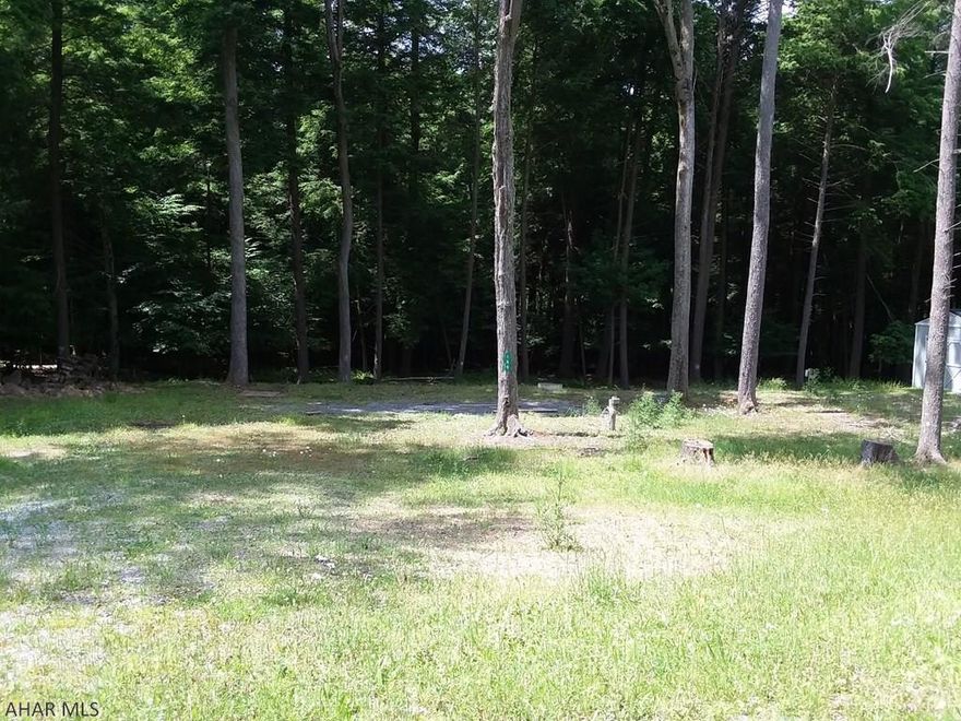 Camping is about being near nature, the woods, outside.  These two adjacent campsites offer plenty of room outdoors for you and your family to enjoy nature.  Backed up against a wooded area you will experience the joy of watching the deer, squirrels and other animals from your campsite.  Whether it is toasting marshmallows for s'mores, relaxing by the community swimming pool or boating on nearby Glendale Lake you will find plenty to do or just relax and do nothing.  Located in Glendale Yearound, a gated community adjacent to Prince Galliztin State Park / Glendale Lake, down the road from State Game Lands 108 and just six miles from Rock Run ATV Park.