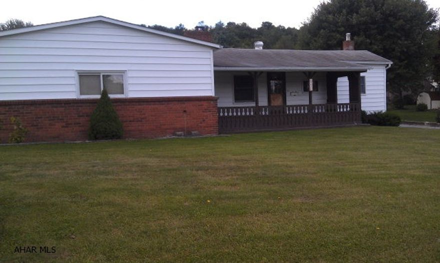 Home is a moble home with full foundation that has been added on to. Lovely location, nice lot, huge front porch, large two cr garage w/ workshop.