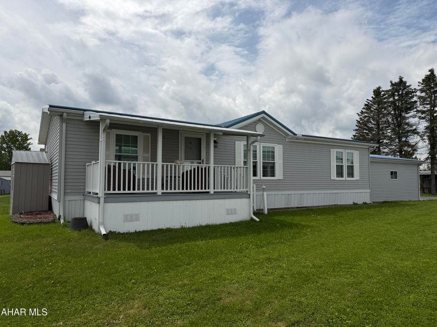 Welcome home to this meticulously maintained double wide, sitting in the Wise Mobile Home Terrace a very desirable 55+ community featuring extremely low lot rent at $230 a month. This beautiful home has a great layout with entertaining at the center of the home.  The kitchen/dining area has space for a large table and has plenty of cabinet space for all your gadgets.  The primary suite sits secluded from the guest quarters, making it very private when out of town guests are here to visit.  The laundry sits right off the primary suite bath room which is very convenient.  There are two porches for entertaining or relaxing and let's talk about the massive garage!  It provides plenty of storage and keeps your vehicle free from snow in the winter.  Newer roof, windows and 2 gas wall heaters will give you peace of mind through all kinds of weather.  Don't miss this rare opportunity.