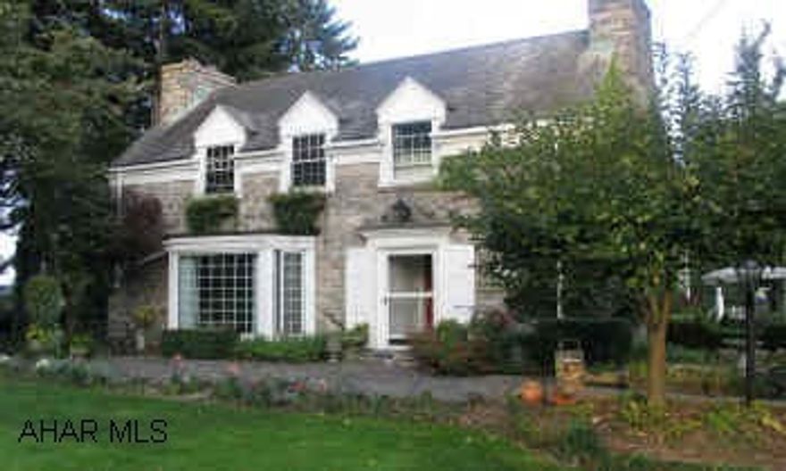 Lovely Two Story cut stone traditional home is an architectural delight. Beautiful manicured gardens. Address: 702 Division Street, Berlin, PA 15530Berlin School District