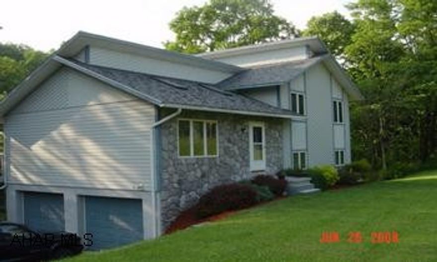 Private setting with a pond.  Multi-level home.  Open floor plan.  Close to town. Private setting with a pond.  Multi-level home.  Open floor plan.  Close to town.