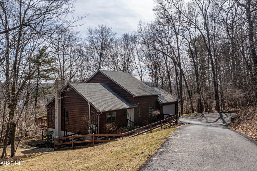 Country living awaits you with this two-story home surrounded by 1.82 acres and only a few short miles from I99, PSU, and shopping. 66 Cedar Ridge Dr. boasts 3 nice sized bedrooms and 2.5 bathrooms. Step into the foyer and walk to the large living room with cathedral ceilings. Remodeled kitchen with granite countertops and open to dining and living room. Step outside from the dining room to the large deck with amazing views. The second floor features a master suite with its own deck, 2 walk in closets and a full bath. The lower level features a family room and 2 large bonus rooms which are wired for a recording studio and a half bath. Welcome home. Schedule your tour.