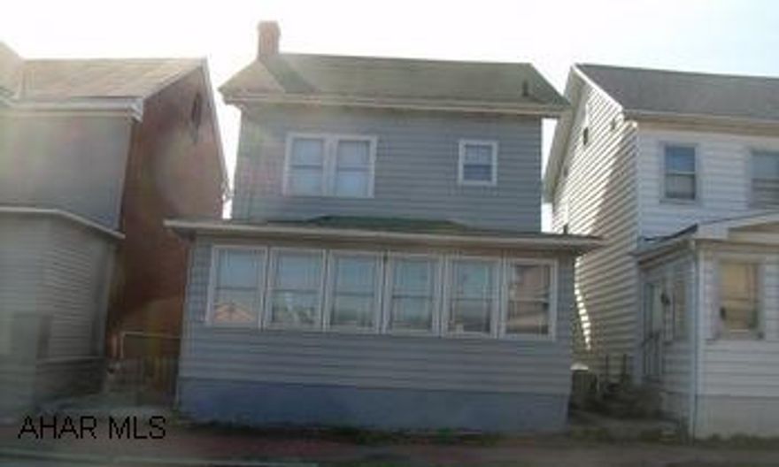 2 1/2 story Frame with off street parking. Nice starter home. Nice size rooms. Large Kitchen. Enclosed front and rear porches. Off street parking. Maintained very well. Priced to sell. Call Hank.