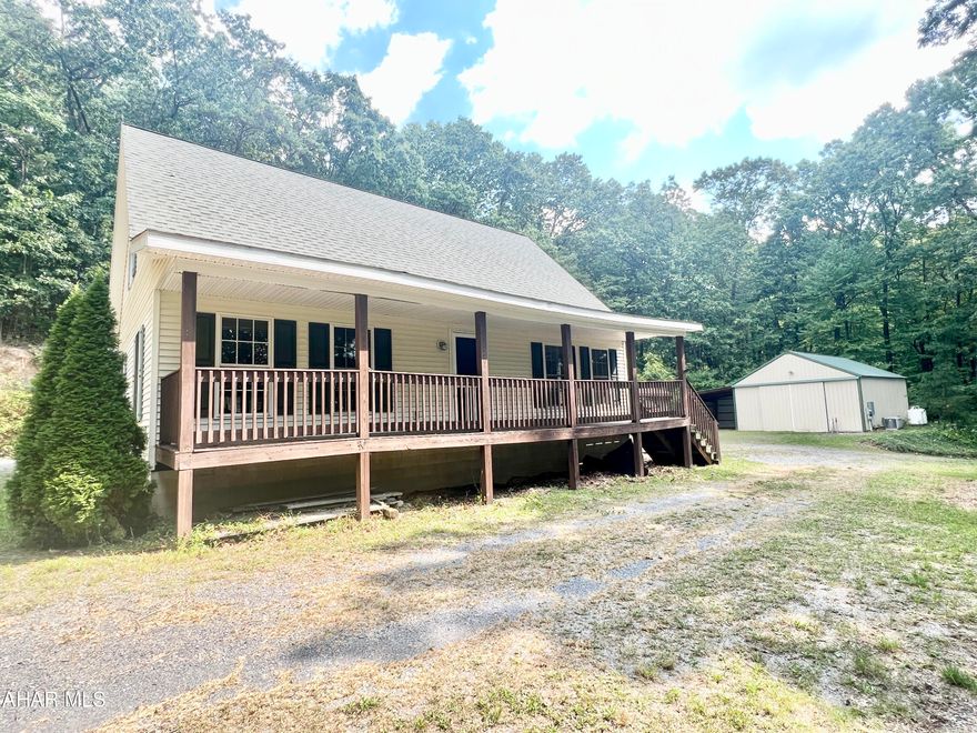 Secluded 2 Bedroom, 2.5 bath home nestled in the woods resting on 4.4+/- acres. The main floor of the home offers a living room, eat-in kitchen, primary bedroom, and 1.5 baths. The second floor offers a bedroom, full bath, and a bonus storage area that could be finished to be a 3rd bedroom. Outside you will find a covered porch, 24' x 32' garage, multiple sheds, gazebo, &  whole house generator. The property offers easy access to I-70 & PA Turnpike.