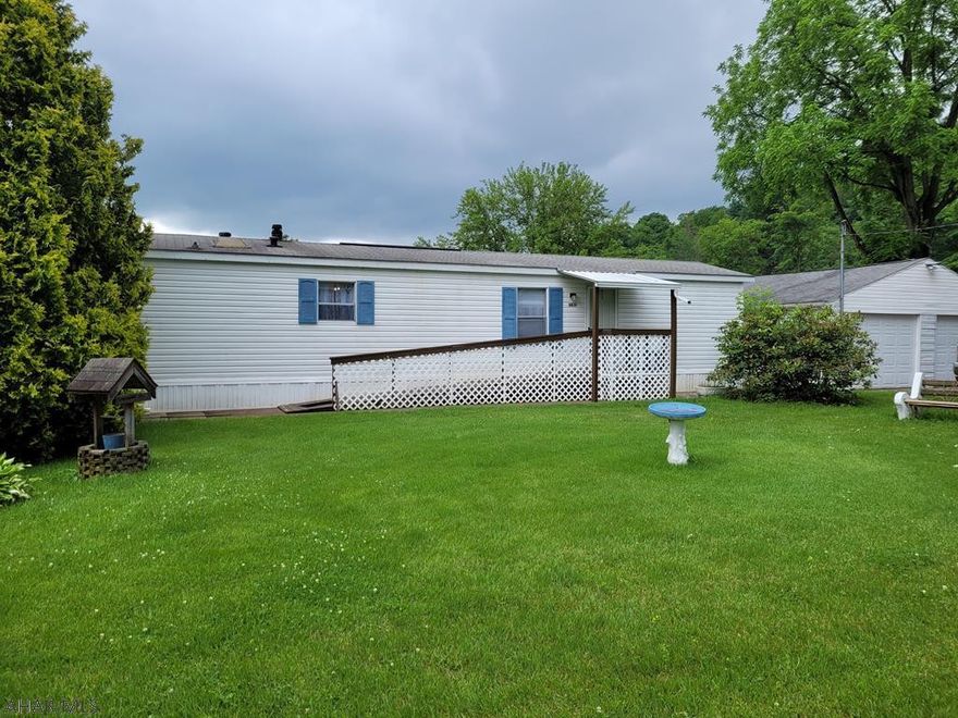 Well maintained 2 bedroom 1 and 3/4 bath sitting on a nice level lot. The house has been well maintained and offers a covered back porch for outdoor entertaining. The 2 car garage used to be a service garage for an auto mechanic repair. Property is being sold in AS-IS condition. Seller to make no repairs. Title is not retired but seller has title.