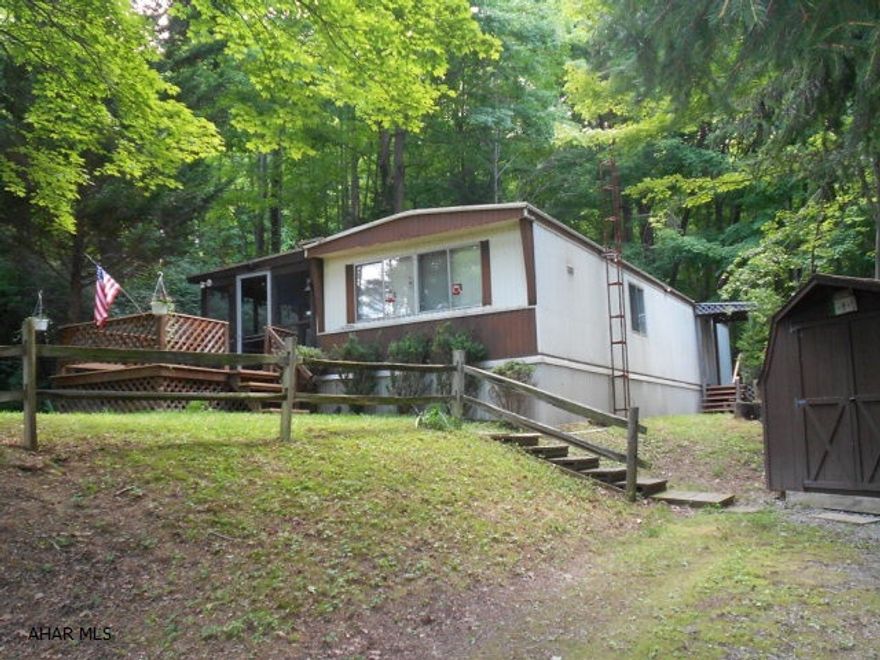 Mobile home with seclusion. Great get-a-way or weekend retreat. Surrounded by woods and hunting galore. Has been very well kept and includes most of the furnishings including plates, towels, etc. Has 6.602 acres. Take a look. Seller has enjoyed the many features the property has to offer.