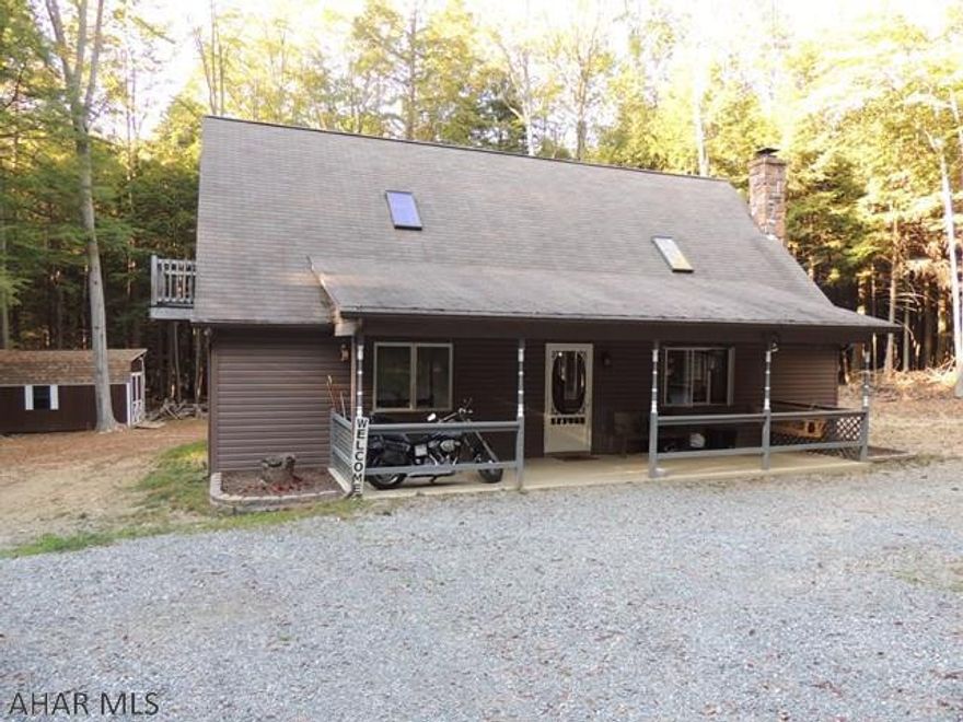 Great home on over 1 acre lot! Open floor plan. The seller has recently updated the kitchen, bathroom has ceramic tile heated floors and more! This home features vaulted ceilings, wood burning fire place, 2 bedrooms on the main floor and a large master bedroom with a balcony in the loft. ( Upstairs plumbed for bathroom) Just move in and enjoy the nature that surrounds you.