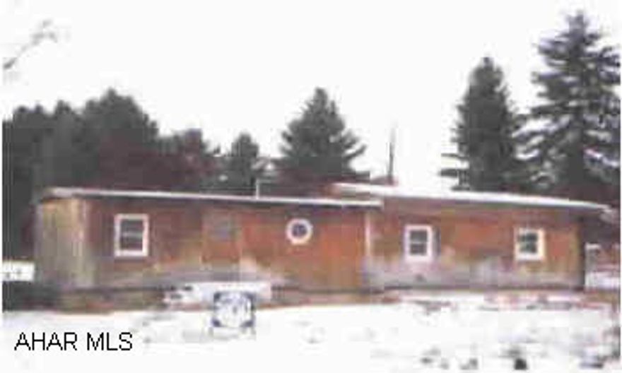 Older mobile home on 1/2 acre lot. Public water and sewer. Mobile home needs some TLC. Older mobile home on 1/2 acre lot. Public water and sewer. Mobile home needs some TLC.   Electric system - 100 amp