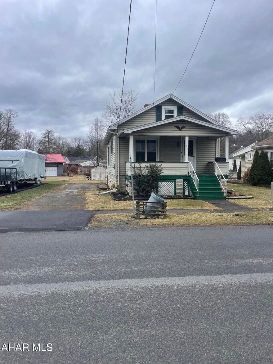 Adorable 2 bedroom home close to everything!! This home offers Living room, dining room, kitchen, pantry, 2 bedrooms and full bath all on one floor, full walk-up attic for storage and enclosed porch. There is also plenty of off street parking, shed and small yard. Don't wait, call today!