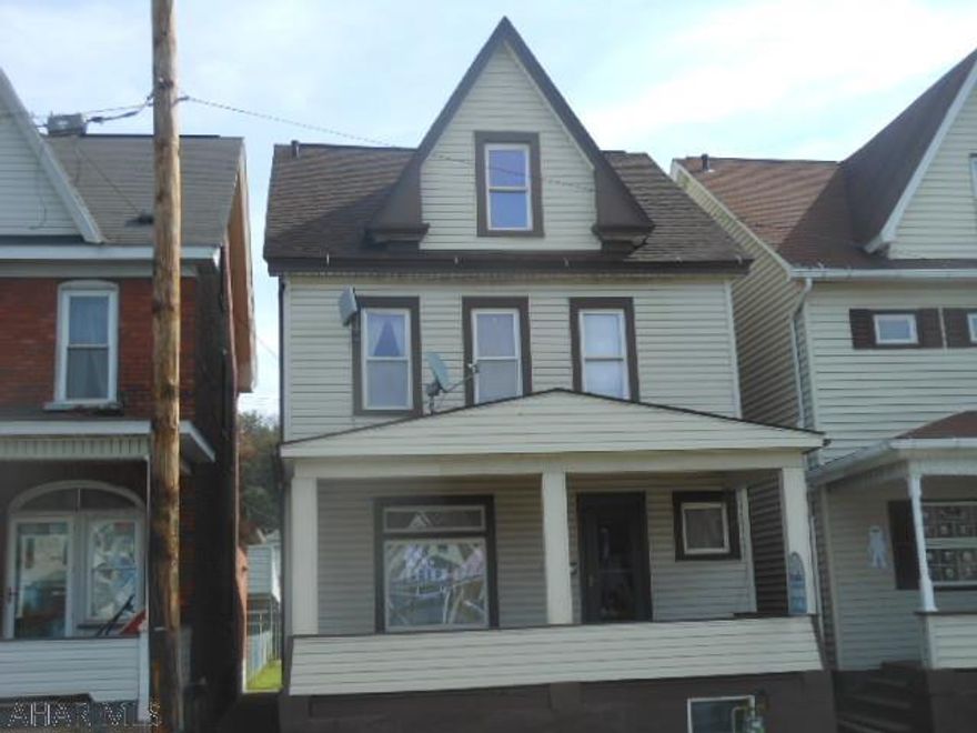 Remodeled kitchen, large living room, enclosed rear porch, newer gas forced air heat with central air, 100 amp circuit breakers, new roof.