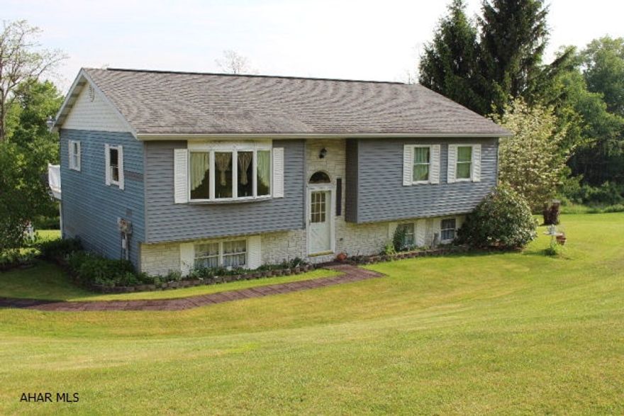 Move in to this spacious home on a private 1 acre lot and enjoy the peace and quiet of county living yet close to town.  Lots of outdoor space for entertaining.  Sit on the composite deck and enjoy the views.  Laminate and tile floors in this home and vinyl siding make for easy upkeep.  New appliances and finished basement make this a great buy in a hot price range.  Don't miss your opportunity to enjoy this 3 bedroom 1 and a half bathroom home.