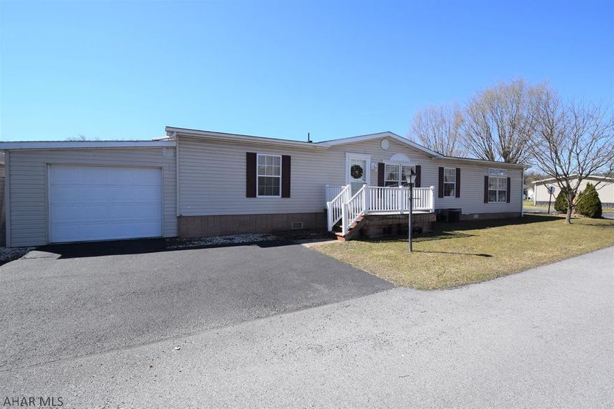 This is an incredible opportunity for someone looking to just move in with just their clothes and personal belongings.  Fully (and beautifully) furnished home that has been meticulously maintained.  Over 1700 square feet of living space with tons of natural light.  Open floor plan and vaulted ceilings.  Kitchen opens to breakfast seating area, family room, and formal dining area.  Formal living room, three bedrooms and two full baths including master bath with garden tub and separate shower.  Back entrance is through nice mud room and laundry area.  Covered rear porch.  One car garage.  Off street parking for four cars.  Buyers must make application and be approved by Mobile Home Park.  Lot rent is approx $392.00