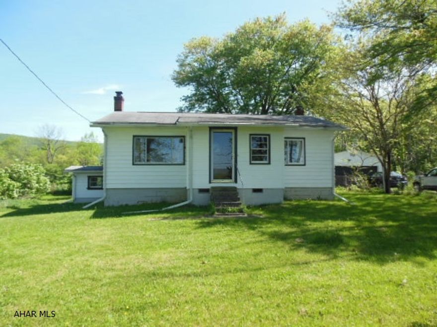 Rare Opportunity to get out of the city to a beautiful setting with beautiful views of nature with no neighbors close to you! Great hunting, fishing, & birding location. Two bedroom ranch home on just under 1/2 acre with a two car detached garage that has electric, lite TLC is needed, but with a place to do it at your convenience! Well & septic; not in flood zone. (Not required for existing mortgage) Fresh air! Updated furnace. Unusual find!! No VA or FHA financing.