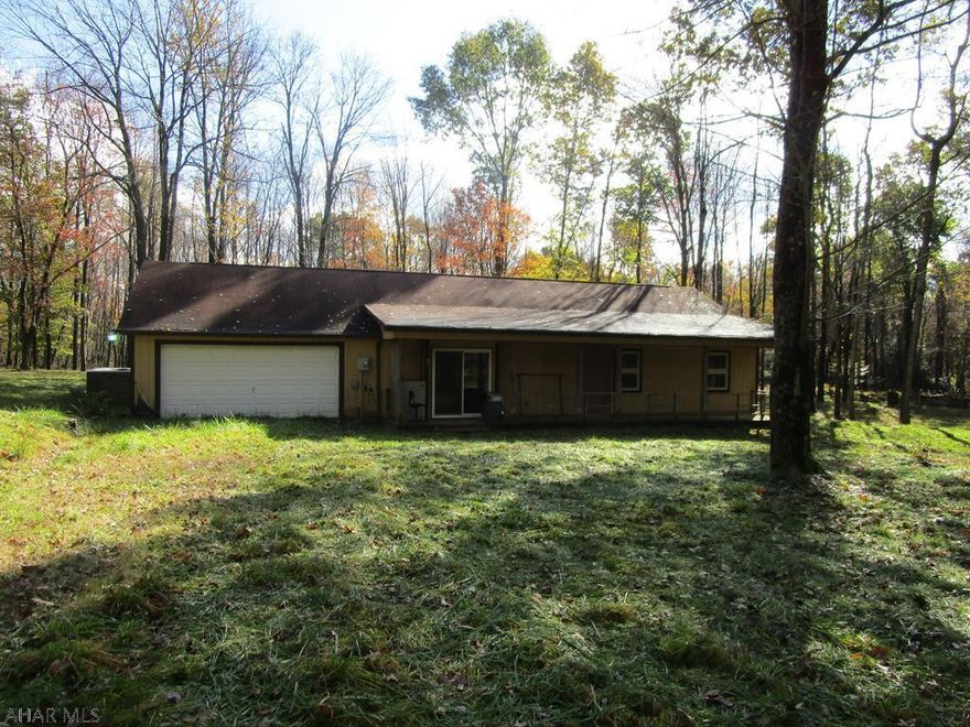 Great chance to own a nice rancher on 6 wooded acres in a private country setting! Large eat-in kitchen, tile floors, attached 2-car garage. Coal stoker hot water heat. Needs a little work but great location.
