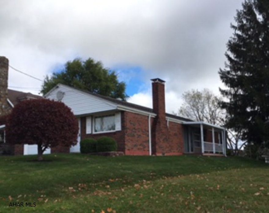 Beautiful 3 bedroom brick ranch without a basement on a nice lot in Ebensburg.  Carpeting  throughout ..1 step down sunroom