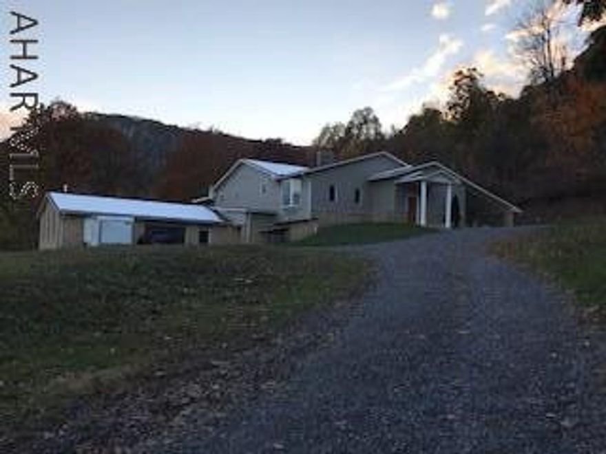 Enjoy the view from the unique spacious home bordering state game lands (**Attention Hunters**). Large raised ranch, main floor has large living room, dining room, kitchen, walk-in pantry, master bedroom, master bath, bedroom, bath, bedroom, lower level - large family room with fireplace and bar, bedroom with private bath, lower level has separate entrance, loads of storage, perfect "mother-in-law suite". Stainless appliances, granite counters, tile floor, hardwood floors, 3 zone heating, (propane), newer roof, above ground pool, new well (430 ft), new hot water tank, 2 + car garage with work shop and wood burner, carport, central air, large barn (no zoning - Horse lovers), fenced. This house has it all!!!