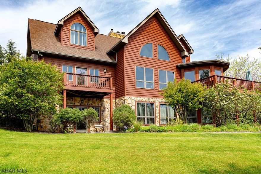 Best views around! Very convenient, yet private location.  Cedar sided, contemporary design featuring 4 bedrooms and 4 baths. Spacious kitchen with lots of storage...opens to screened porch.  First floor Owners' Suite boasting his and her walk-in closets, updated bath and a private deck. Upstairs you'll find 3 spacious bedrooms and a new bath and more storage.  Lower level is perfect for entertaining or exercising...bright and cheery...plus there is another stone FP and one more bath.  Lots of storage here, too! More features include freshly painted walls, new flooring, Sec System, 3 zoned heat, Gutter Guard and more. You're sure to enjoy the views from all rooms and the walk around deck....great setting!!