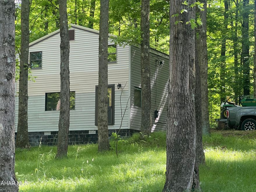 Unfinished hunting camp/vacation cabin near Prince Gallitzin State Park and Rock Run Rec Area. Vinyl sided two story camp, built in 1995, with kitchen, living room and unfinished bath and 2 bedrooms. Insulated and electric breakers.  Has well and septic on site but not hooked up. Outhouse and storage shed. Woodburner in the living room. Located on 2.3 acres of wooded land. Lots of game lands in the area.