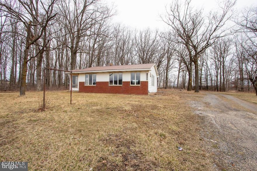 Discover the perfect blend of opportunity and tranquility with this 18-acre property, ideally located just off busy Route 322 and only minutes from the I-80 exchange at Woodland. The land offers a mix of open pasture and peaceful wooded areas—perfect for building your dream home, starting a hunting retreat, or simply enjoying nature. A small commercial building on the property adds even more potential! Use it as an office, hair salon, or convert it into a charming rental for extra income. Whether you're dreaming of country living, a business venture, or both—this property is ready to make it happen. Oil, gas, and mineral rights convey, giving you added long-term value. With its prime location and versatile zoning, this is a rare opportunity to create something truly special.
