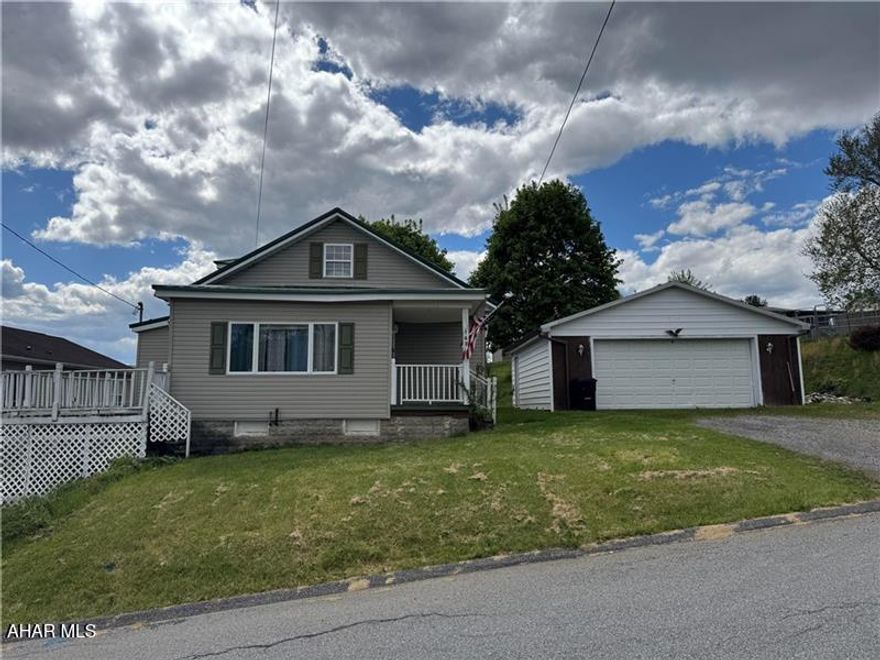 What a great opportunity to get started in Nanty Glo with a large driveway and 2-car garage! The home offers your classic open layout with living room, dining room, kitchen, and two bedrooms on the main floor. Not to mention the 3-season enclosed front porch with patio doors to the deck. The electric fireplace and all appliances are included, making it simple to move right in. One of bedrooms on the main floor is currently setup as a laundry room too, but could easily be converted back if preferred. Upstairs are two additional bedrooms and some storage/play spaces. The backyard has enough area for some fun, a shed for extra storage, and includes a fenced-in area for your pets. It's close to local shopping, gas station, and hometown restaurants... but still far enough off of main street for some peace and quiet.