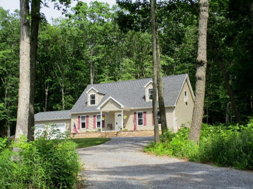 Spacious 2009-built, modular home - 6-inch ext. walls; roof trusses 16-inch on center; 5/8-inch roof sheathing; upgraded/enhanced partition walls; New England insulation package; attached 30' x 24', insulated garage; partial house generator setup (generator included in sale); radon remediation syst.; poured-concrete basement with 9'-high ceiling for future finish; excellent closet space; dormers; circular drive; ft. porch with panoramic views of countryside; private back deck & patio with woodland views.  A very nice 7.52-acre wooded setting!  100% MONEY-BACK GUARANTEE OFFERED - RESTRICTIONS APPLY.