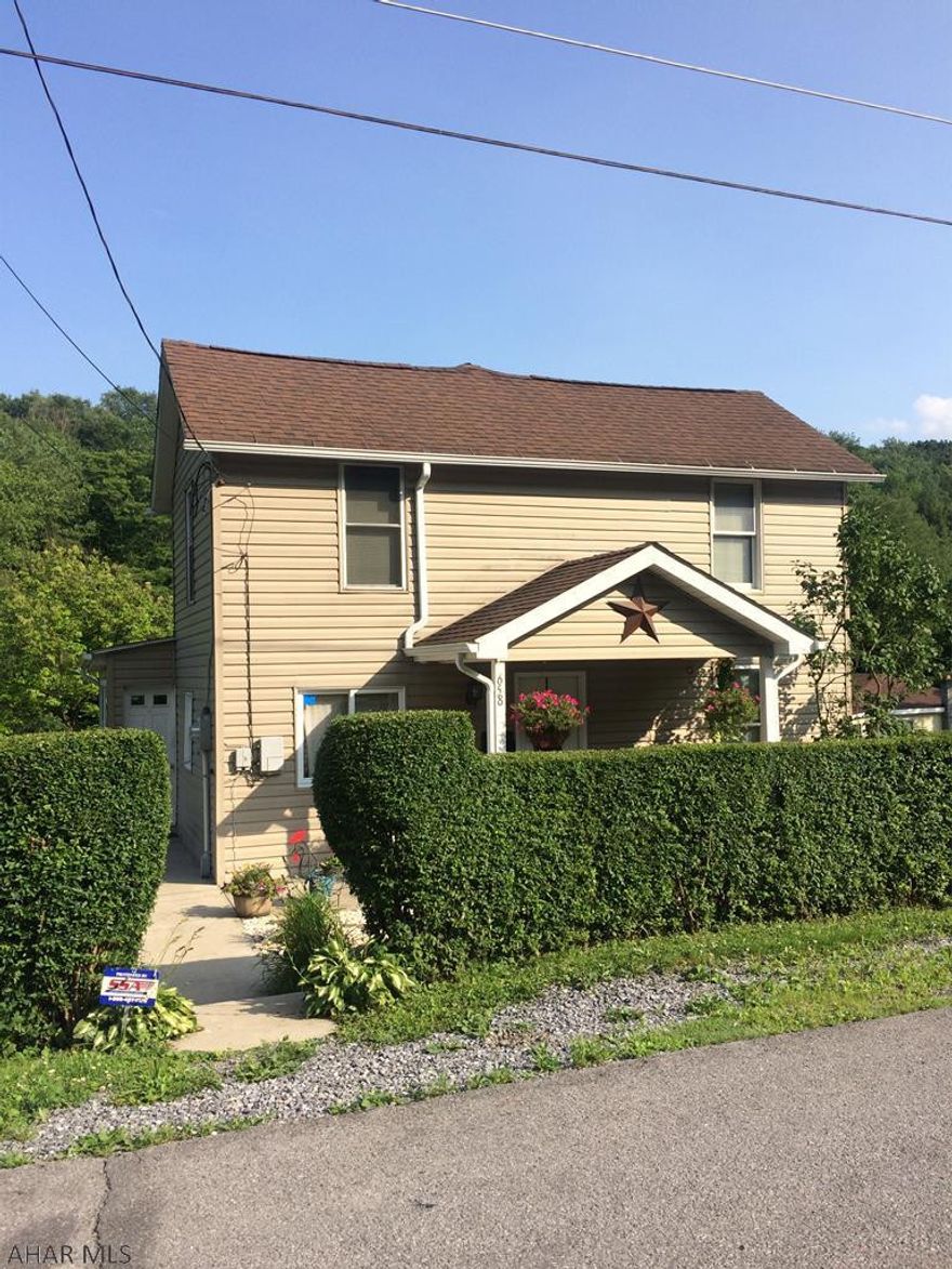 Remodeled two story vinyl sided home on a large, approx 1.47 acre lot. The home has been tastefully remodeled including new drywall, oak trim, 1.75 baths, rewired with 200 amp breakers and generator hookup. Roof is approx 8 yrs old and windows were replaced. Oil boiler is approx 4 yrs with a wood/ coal in addition. Two separate garages, both detached, with one being a newer pole type with extra room for storage. The lot has pear, peach and chestnut trees planted and extends to a small stream at the rear border. Truly a great home for the $$.