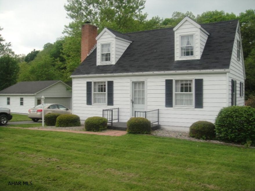 Lovely Cape Cod in beautiful Snake Spring Valley. 1.94 flat acres with 2 garages, 26'x26' and 18'x24'. Stream in rear of property. Stone fire place, central air/heat pump. Beautiful location with a million dollar view!