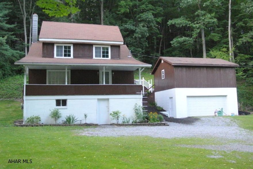 Well maintained, 3 BR 1 BA, newer 2 car garage with large workshop.  Hardwood floors, propane FP in living room. Hot tub stays.