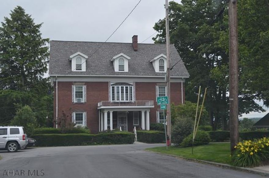Stately Brick Estate in Ebensburg Boro on a large 1.14 ac. Double staircase, built in bookshelves & china closet.  Wood pocket doors. Needs work, but would be worth every $$ put into it.  New roof 2010.  It would make a great Bed & Breakfast!