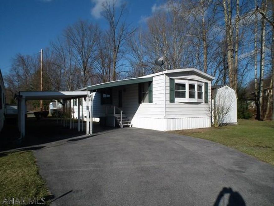 55+ Community, Single-wide located end of street with wooded view. Deck in back & carport. 2 bedroom & 2 baths, eat-in kitchen. Lot rent is $342-includes sewer. Anticipated new tax 2017 $91.64 (not confirmed).