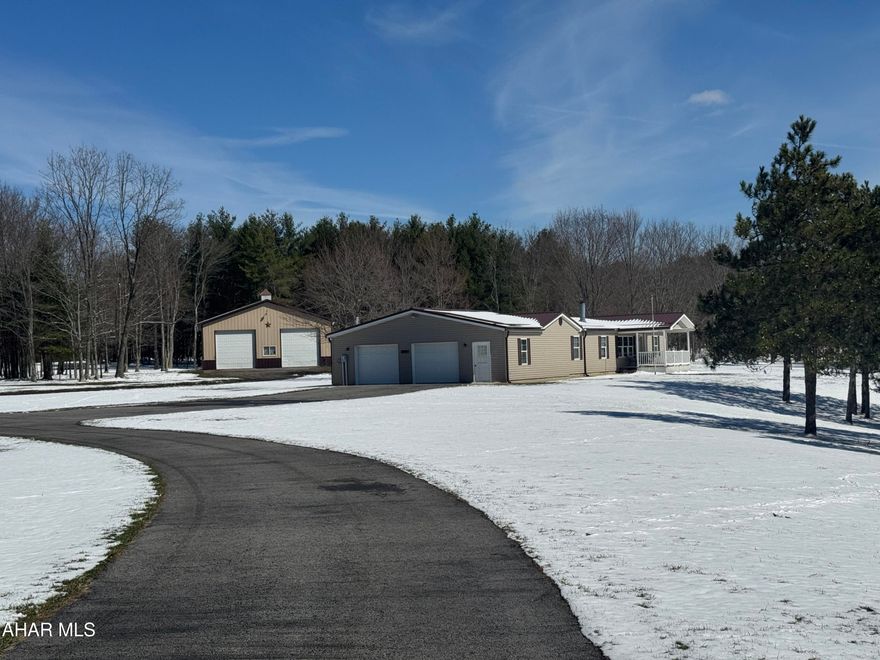 Rural paradise - 75.9 acres with a beautiful doublewide on a full basement foundation. The home features 3 bedrooms, 2 full bathrooms, living room with fireplace, eat in kitchen with dining area, laundry room and attached 2.5 car attached garage. There is a partially finished basement. Large pizza oven hooked up for your enjoyment. Outside there is a large pole garage with concrete floor, 2 ponds and picnic area. Topo is good with both wooded and cleared land. Turkeys and deer feed in the backyard! Remarkable property with lots to offer!