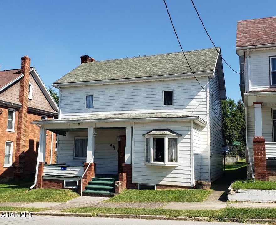 3-bedroom 1 3/4-bath home with formal dining room, 1st floor bonus room, 1+ car detached garage with work benches + storage above on 50x150 lot. J-631