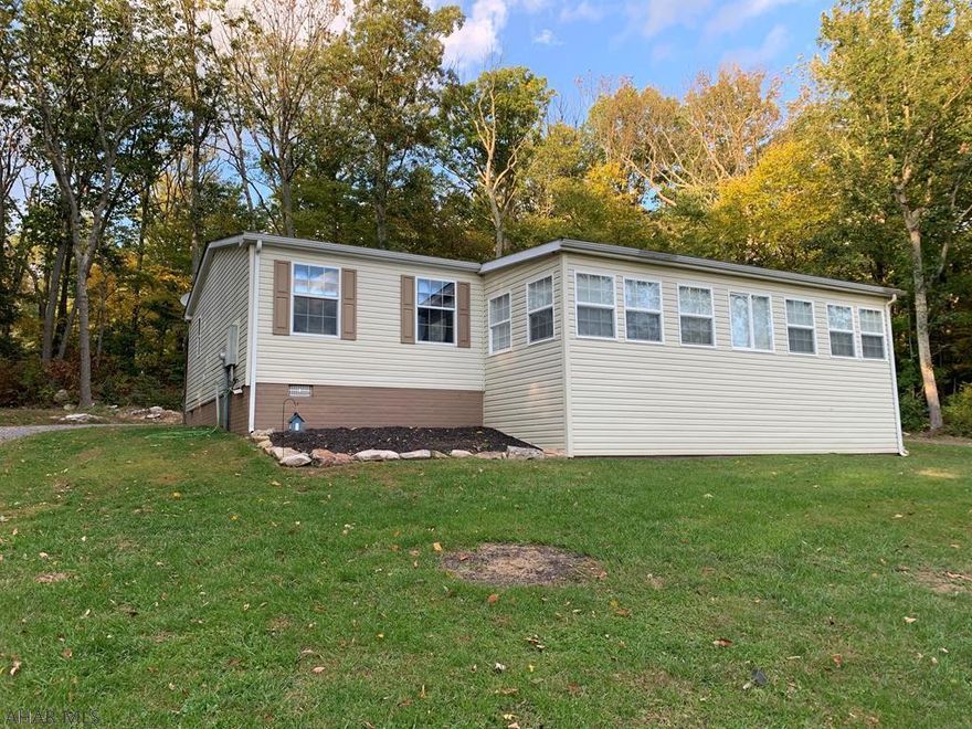 Make this your new home!  3 bedroom, 2 bath updated doublewide on foundation. Just on over an acre. Large living and dinning space! Spacious updated bedrooms and baths. Updates upon updates!! A MUST SEE!!! Close to PA Turnpike and Interstate 70.  A $100 per year fee goes to the association for road maintenance and cleaning.  Come enjoy your new sunroom and watch the snow fall!