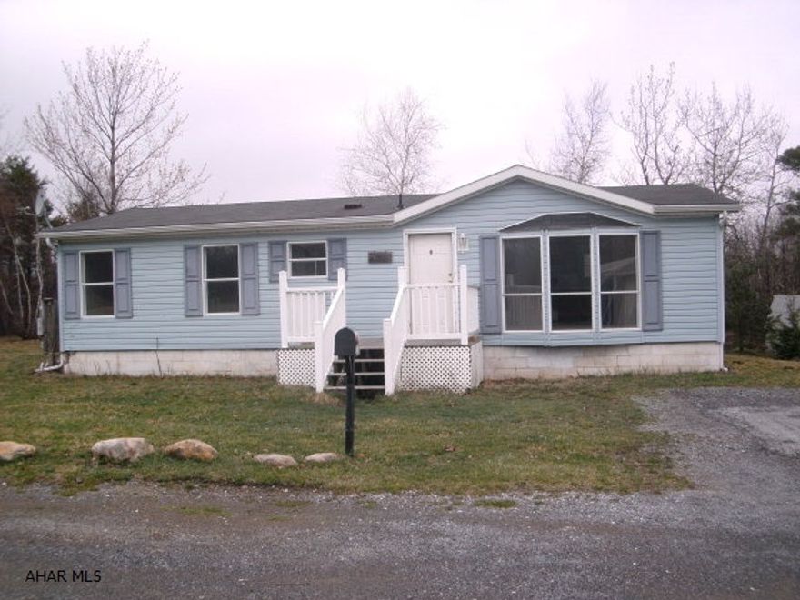 Very nice doublewide on extra large lot. Perfect location would be a great starter home. Seller will provide an allowance to repair back door.