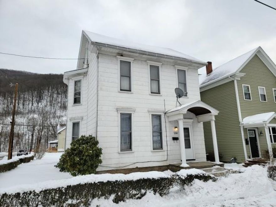 2 1/2 story, 3 bedroom home on nice corner lot. Fireplace in living room. Covered rear patio.