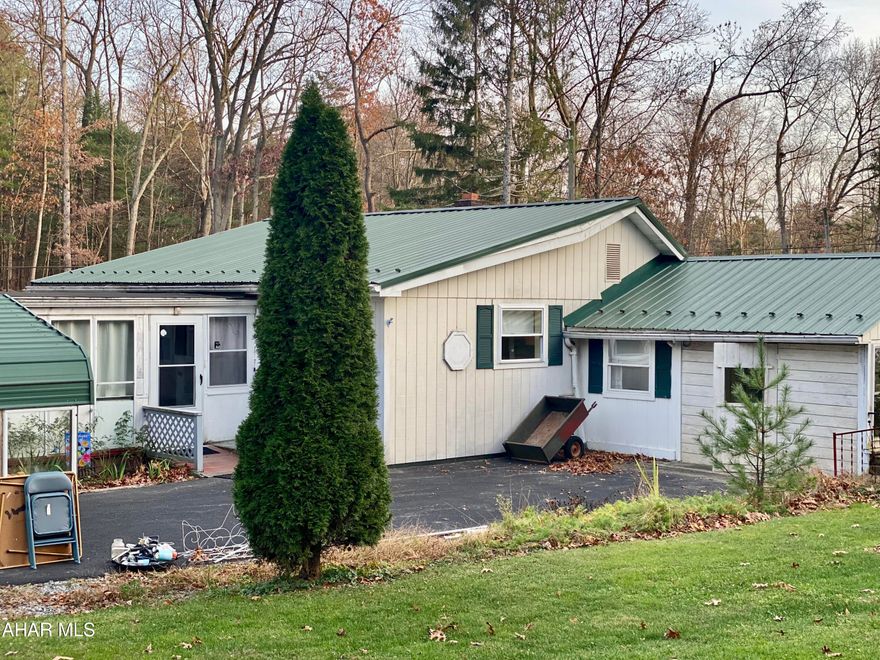If you're looking for a cozy one- story living home with outdoor space, look no further. Bring your vision and and with a litle TLC, you can make this home your own.  This two bedroom home is situated on 1 acre with several outbuildings and a carport with two entrances from Petersburg Pike.  There is also an additional adjoining 8.22 acre parcel (Parcel #: 25-11-08.4) being sold separately or can be sold together.   Enjoy Country living, with a short commute to Huntingdon, Alexandria, State College, and Altoona.  If you're a hunter, this property is calling your name, minutes to state game land.  This would make a great home away from home to get out and enjoy all nature has to offer or call it your permanent home sweet home, the choice is yours.