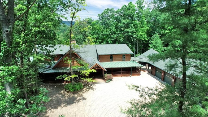 Secluded log home on 162.7 acres. Two sides of this property border 1271 acres of State Forest Lands. Great hunting!  4717 square feet of finished space in this beautiful, spacious home. 3 Bedrooms. 2.5 Baths. Foyer w/double doors. Great room w/vaulted ceiling, hardwood, 10' stone fireplace, rounded wall of windows. New kitchen in 2020 w/upgrades & garden window w/seat.  Dining Room has rounded windows. Master bedroom is ceramic tile w/log stairs to loft, 10x8 W-I-C. Master Bath w/Jacuzzi, his/her vanities, ceramic, shower, door to hot tub. Loft at dining area has bonus room, office, half bath. Wrap-around porches. Outdoor living space - 28x28 pergola w/kitchen, water feature, fire pit. 7 garages, heated. Equipment pole building. Shed. Pond. Orchard. Central Vac. Security System. Wildlife!