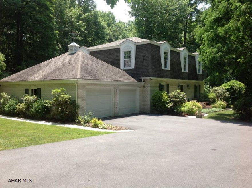 Beautiful upscale, 2 story white brick home on 2.02 acres, minutes from downtown Bedford. 3 1/2 BA, 4 BR with hardwood flooring. Master suite with walk-in closet and nicely renovated bath with natural light skylights,glass enclosed shower, granite his and her sinks. Open foyer is accented by a spiral staircase. Kitchen has new glazed cabinets,granite tops, convection wall ovens, w/island accented with stainless appliances, wet bar and a breakfast nook overlooking the water garden on the patio. Formal dining room and living room. The Family room has a marble gas fireplace and hardwood FL. Off the family room is a 50x30 glazed wood sunroom for additional space and a wood deck to accent the landscaping. Hot tub hook-up available. Finished basement with gas fireplace and sanua.