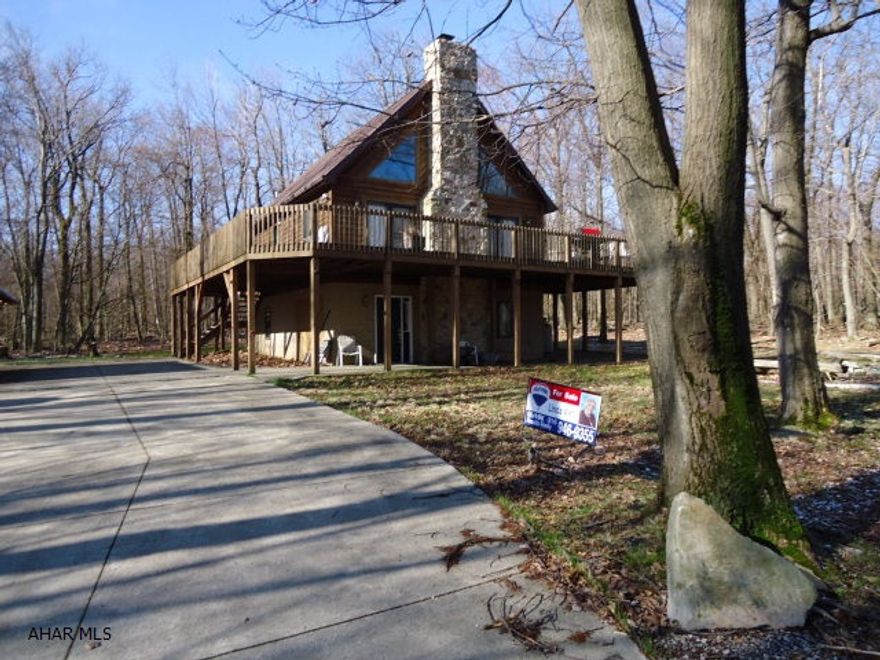 Furnished home in the woods at Blue Knob Resort. Hardwood Floors, wood ceilings, stone Fire Place and vaulted ceilings in the Living Room. Electric and Propane heat. Wrap around deck and shed. Includes extra lot in back. Taxes and association dues are totals for both parcels. Dues include trash, road maintenance and use of outdoor pool. Extra $100 yr allows use of indoor pool and hot tub.