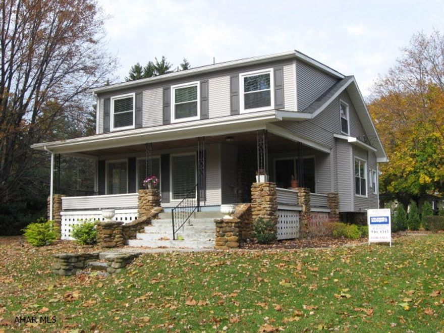 Classic 2 story home on a large, wooded lot in Eldorado.  New kitchen with all new  appliances, remodeled lst and 2nd floor baths. Living rm with stone fireplace. Charming wraparound covered  porch. Newer furnace, roof, vinyl siding, soffit & facia and windows.Second floor paneling removed and newly drywalled.  All windows have blinds.  Large 2 car detached garage with sep. breaker box.