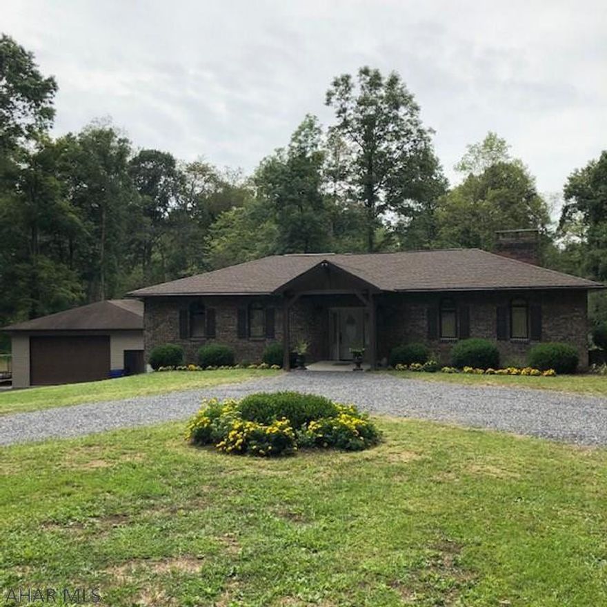 This updated home is situated on a mostly wooded 4 acre lot just minutes from downtown Bedford.  Walk in to the spacious foyer and you'll appreciate the open concept living plan of this home. You'll see views straight through the dining area to the covered patio surrounded by beautiful flowers. Enjoy the updated kitchen with stainless steel appliances and beautiful granite counter tops.  Step down in to the sunken living room with a huge brick fireplace and round top windows that give this home character. The master bedroom and gorgeous 3/4 en-suite bath are conveniently located on one side of the house and has access to a rear patio area of its own. A massive garage with plenty of space for toys and a welcoming circular driveway are just a few other touches that make this home unique.