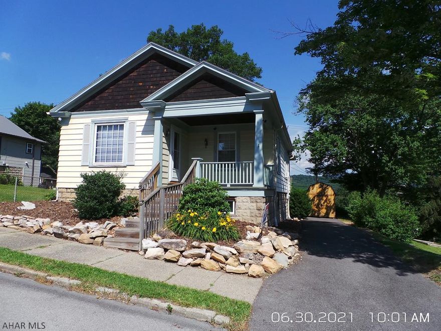 Cut & cozy 2 Bedroom home on a corner with 4 city lots!  Awesome view from the rear sun porch!  All appliances included.  Tax card shows address as 100 & 102 Pine for lot and 104 & 106 for house.
