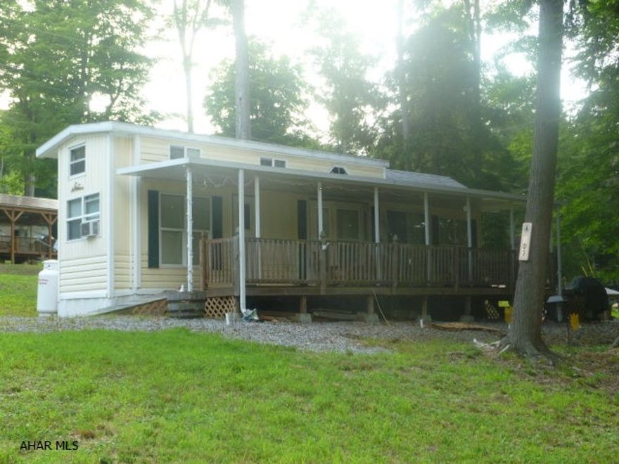 Bring the family because there is room for all.  Two bedrooms, a loft for the kids and additional sleep spaces allows up to ten people to comfortably sleep here.  The full length deck gives you room for enjoying the outdoors, even on those rainy days.  Situated on an oversized lot you have extra room for parking or outdoor fun.  Full size appliances take the roughing it out of your camping experience.  Double pane windows and a special winterizing package means you will be cozy using this property year round. Enjoy the amenities of Glendale Yearound - community pool, tennis/basketball/volleyball courts, planned activities for the whole family and don't forget Poochie Park where Fido can run free.  Glendale Lake and Rock Run ATV Park are not far away.  The good times are about to start.