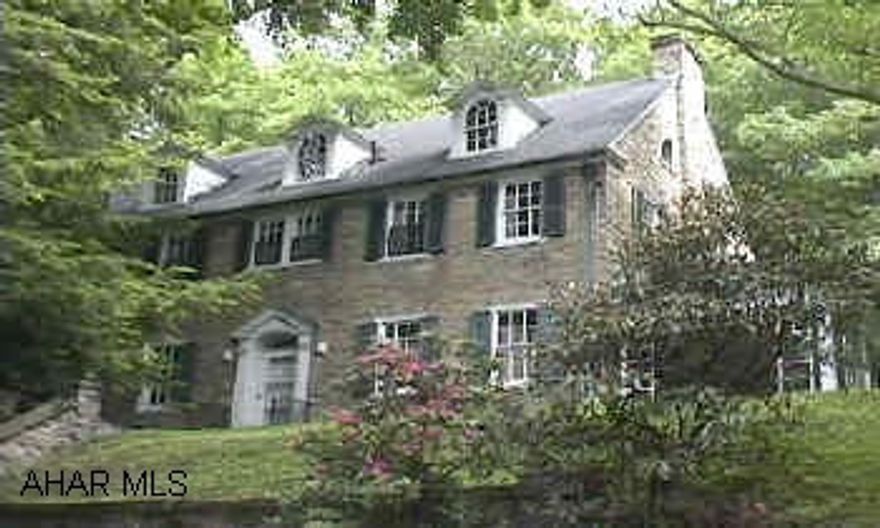 2 1/2 Story stone mansion type home on 6.55 acres. Elegant older home with 5 bedrooms and 3 baths on the second floor.  2 bedrooms and 1 bath on the third floor.  Large rooms throughout.