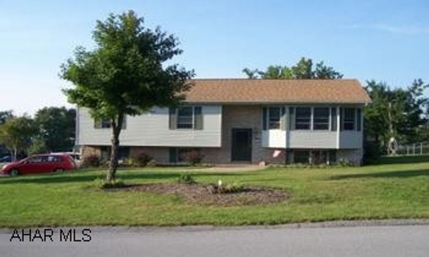 Beautiful Split Entry with large two car integral Garage on 1/2 acre