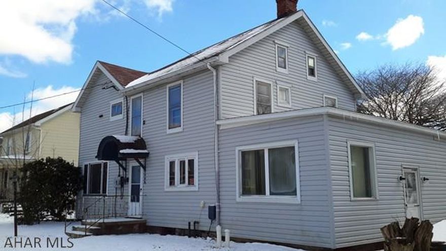 Large duplex located in Gallitzin. Needs some work. Could be converted back to single family home. 2 car detached garage with large, flat lot.