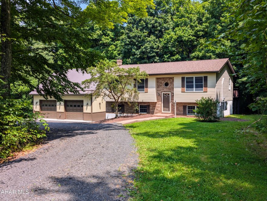 Don't miss out on this home located in a very lovely neighborhood. Home has 3 bedrooms and 2 baths, with a possible 4th bedroom in the lower level. Kitchen/Dining opens to the rear upper deck. Surrounded by trees for privacy , yet plenty of yard for playtime and gardening.  Heat is electric but also has a wood pellet stove in the lower level, mini split in upstairs living room keeps the upstairs cool. Sellers just built a 32X32 insulated garage with heat/electric and water, has storage space above. House roof was replaced in 2022, private well and sand mound.  Take a look at this move in ready home.