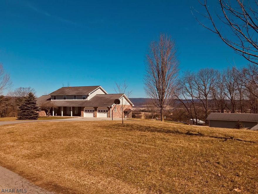 Beautifully renovated home with a view that will take your breath away.  10 acres surrounds the home offering a wonderfully private setting.  A main floor guest retreat with private bathroom and laundry room make one floor living possible. The  2nd floor has 4 spacious bedrooms with a full bathroom.  A wall of windows off the newly renovated kitchen complete with bar and granite countertops open onto the delightful dining and living spaces that all take in the magnificent views that make this home so special. Storage is ambundant as there are walk in pantries and huge closets throughout.  Included is the addition of a new heat pump/central air & new flooring throughout.  A huge back deck looks onto the fenced acres, outbuildings and a setting that must be seen to be truly appreciated.