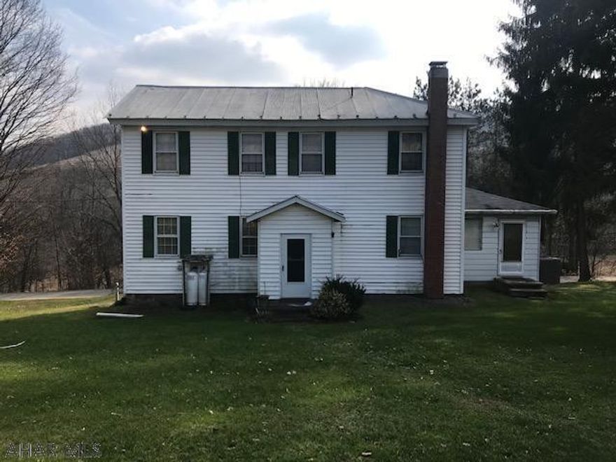 Country farmhouse in a country setting on a nice 5.47 acre site.  Farmhouse has lots of appeal with porches made into a sun room.  Large eat-in kitchen with a formal dining room.  Living room has wood wainscoting.  Two stairways to second floor.  Updated electric with breaker box.  Large bedrooms.  Brand new heating system installed.  Over sized two car detached garage.  Roof was installed in 2008. Call today to view this awesome property.